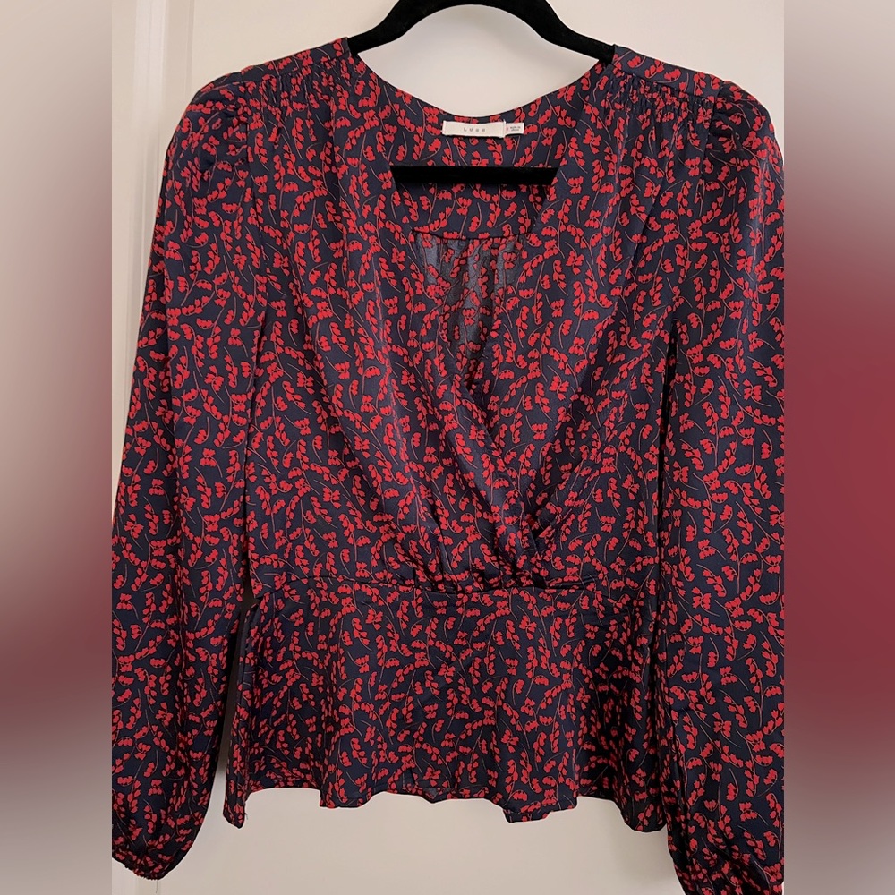 Peplum top.  Silky. Blue with red.